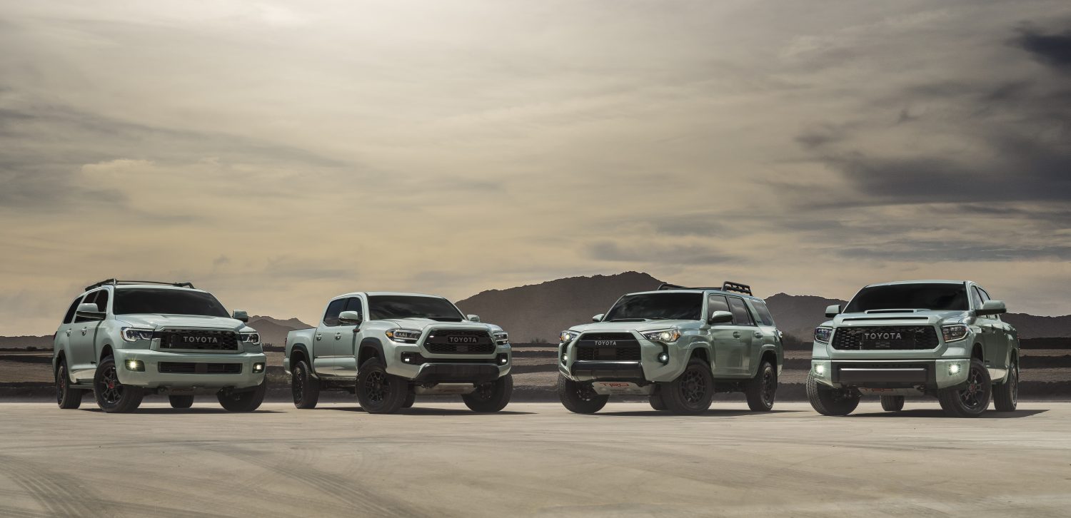 Toyota TRD Pro 2021 lineup in the desert with mountains behind in the distance.