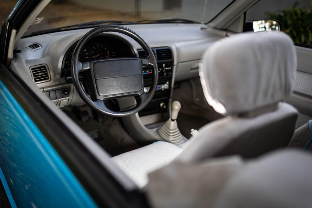 The gray interior of a blue 1992 Geo Metro LSi Convertible