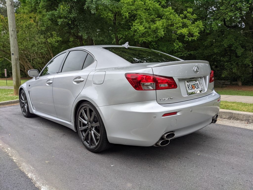 The rear 3/4 view of a silver 2008 Lexus IS F in a parking space