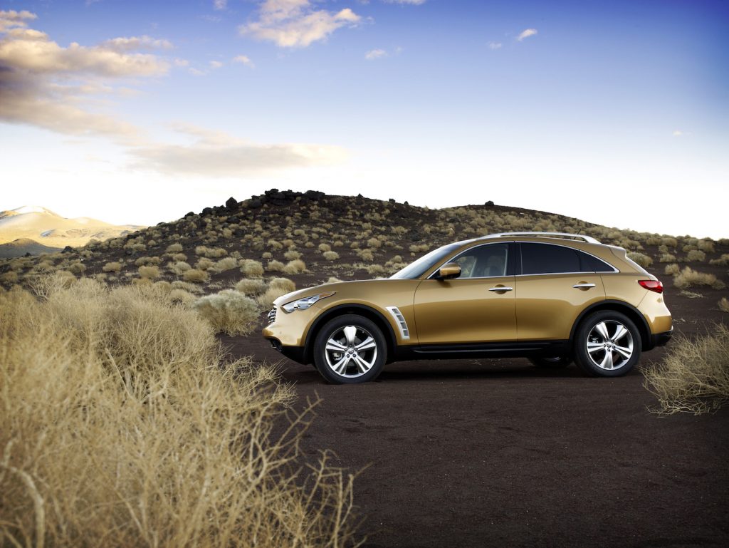 A brown 2009 Infiniti FX parked in the wilderness