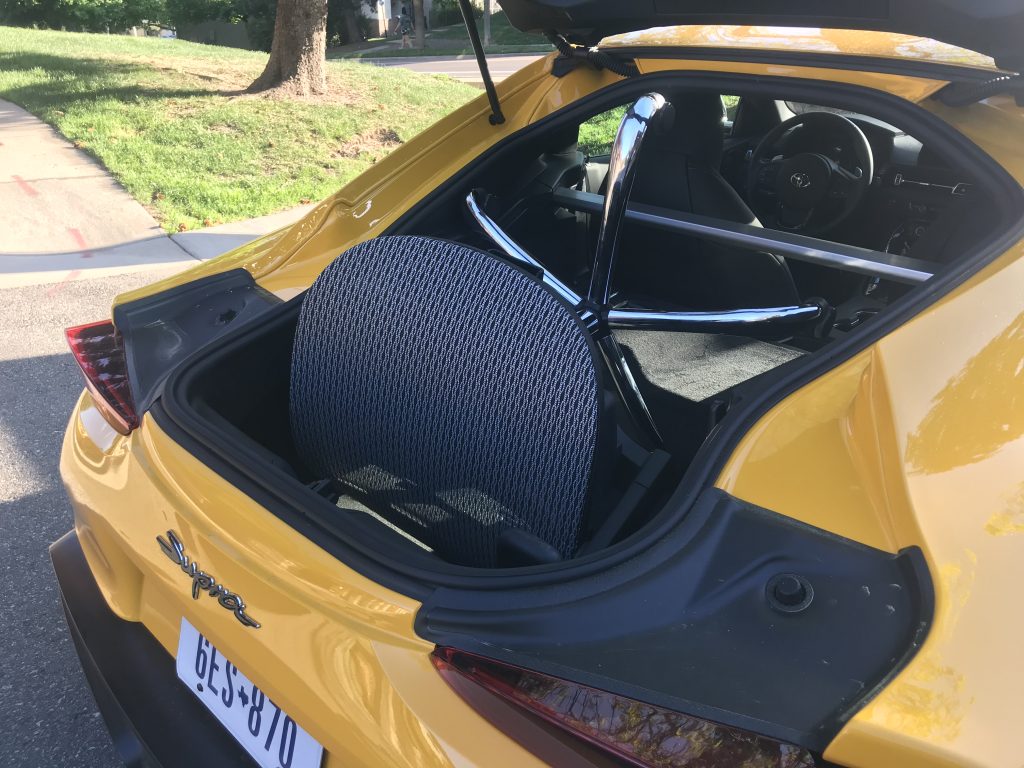 The bottom half of the office chair inside the 2021 Toyota Supra