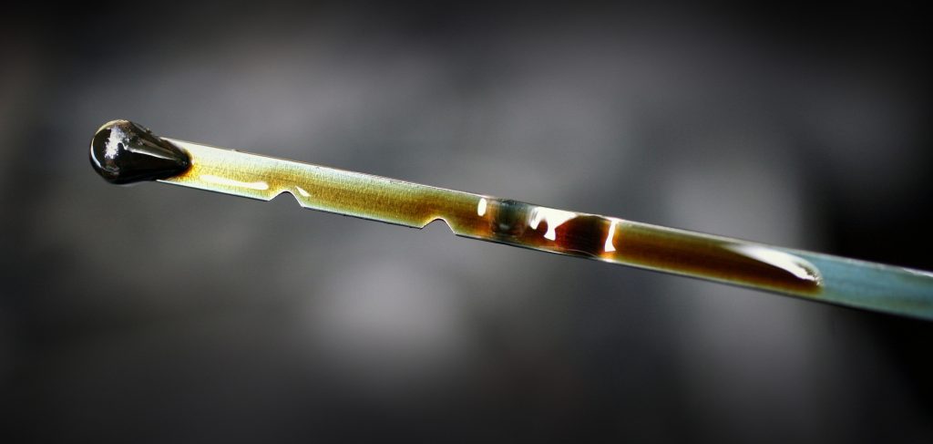 Oil covers a dipstick from a vehicle in Littlebury, U.K., on