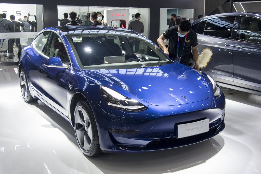 A blue 2021 Model 3 on display. 