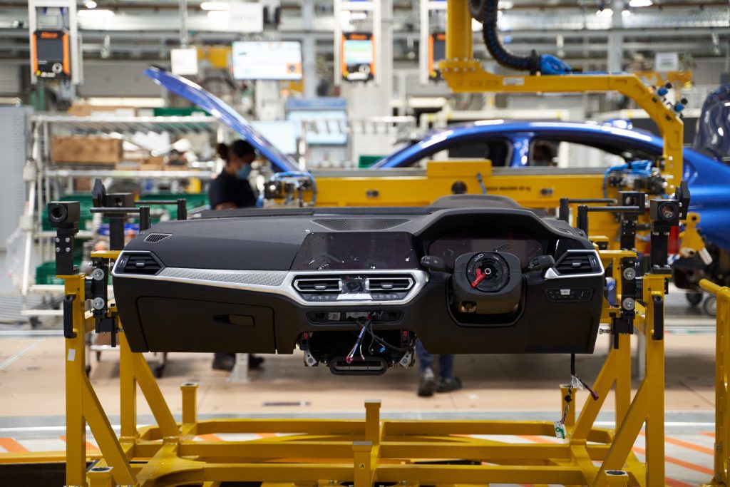 A partially assembled BMW dash on the assembly line in their factory