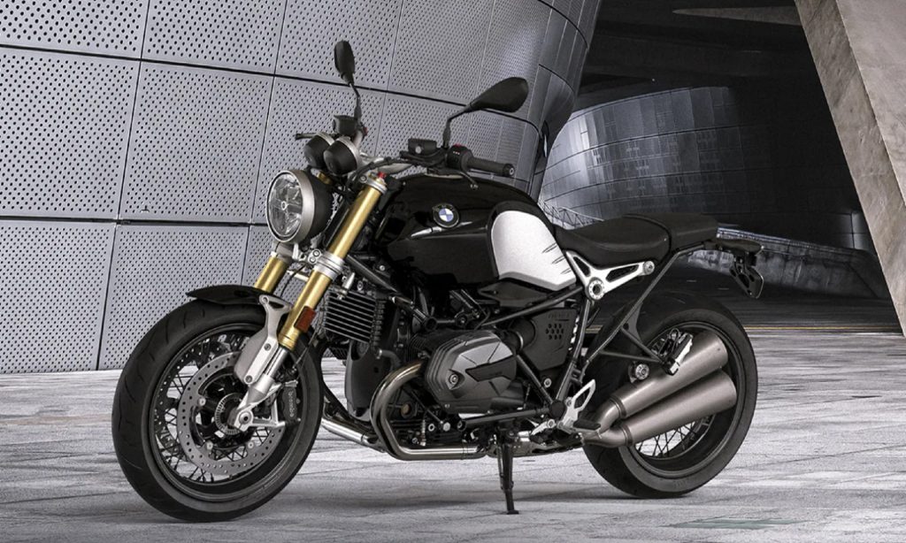 A black-and-silver 2021 BMW R nineT in a gray building