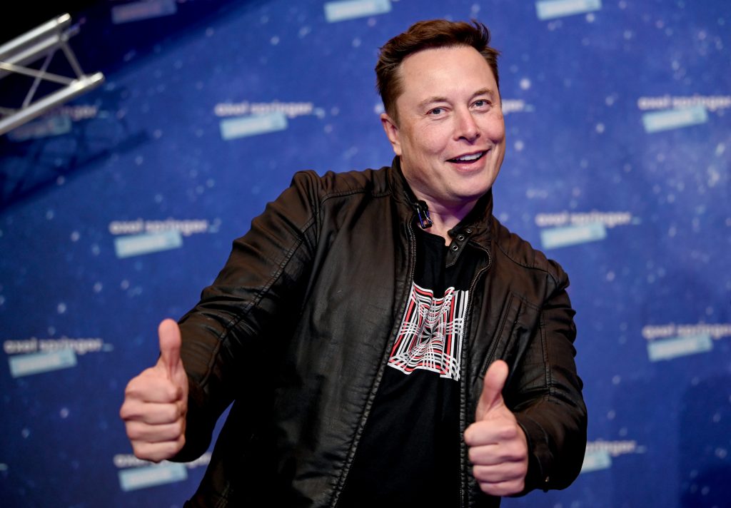 Tesla CEO Elon Musk making a double thumbs up gesture