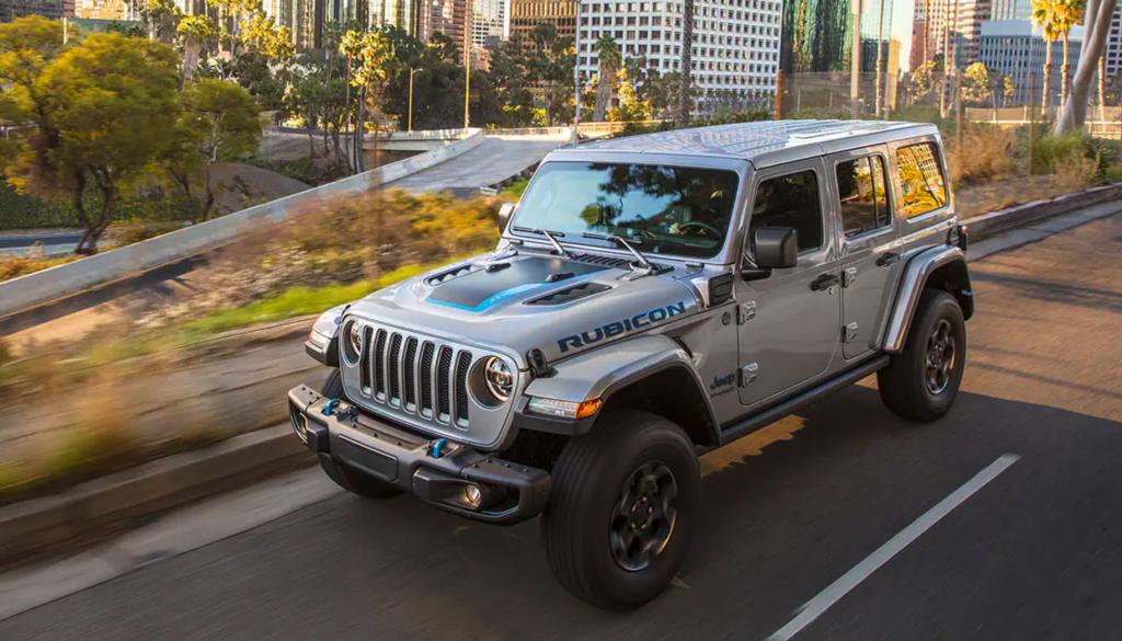 The 2021 Jeep Wrangler 4xe driving on a city street