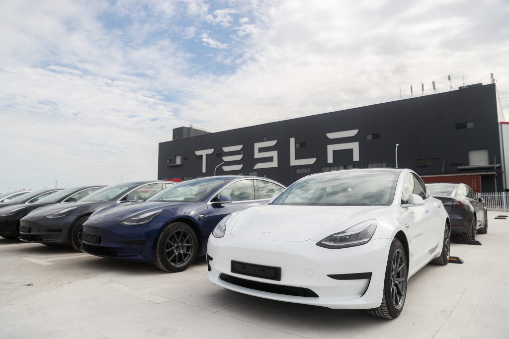 Tesla models parked outside of a Tesla gigafactory