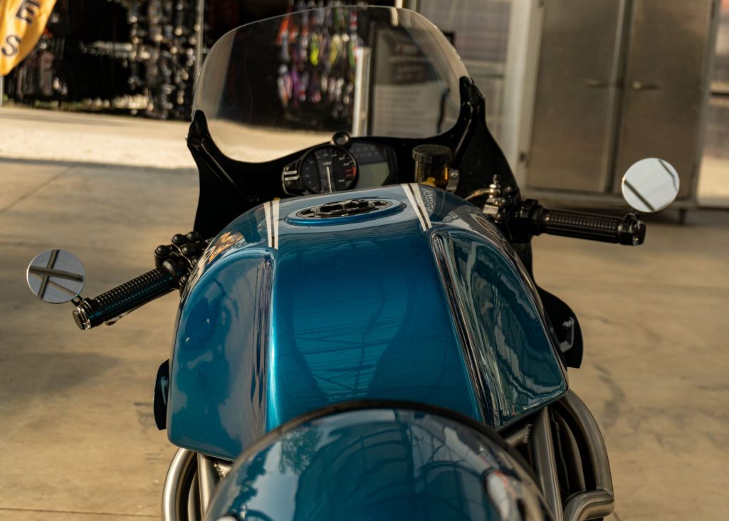 A rear view of Robert Catanese's blue Framecrafters 2021 Yamaha YZF-R1 R1X's fuel tank and handlebars